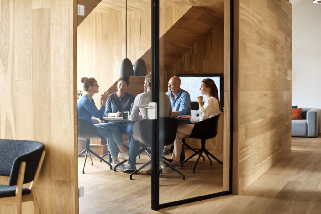 Serene passage aboard a classic motor yacht, coastal mountains beyond—suggesting discretion, range, and composed stewardship.